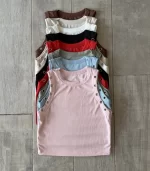 Musculosa larga con ojalillos